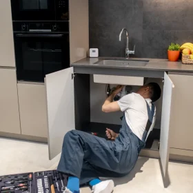 close-examination-man-work-overalls-reclining-floor-near-tool